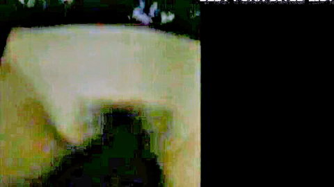 Indonesian woman lying nude on bed, intimate solo pose