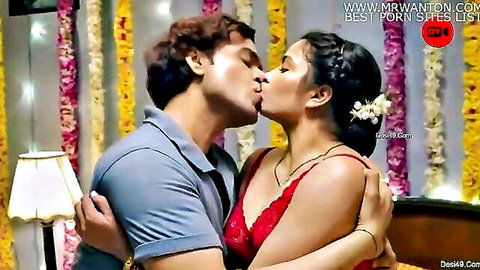 Indian couple passionate kiss in red blouse on suhagrat night