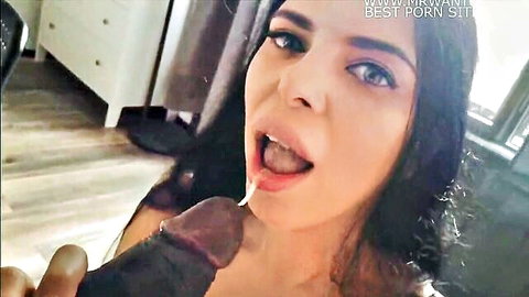 Brunette with blue eyes sticks tongue out licking cum dripping from huge BBC