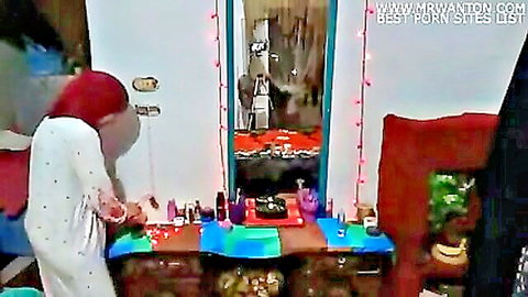 Sexy Arab Egyptian hijab girl in tight white pajamas teases at mirror solo