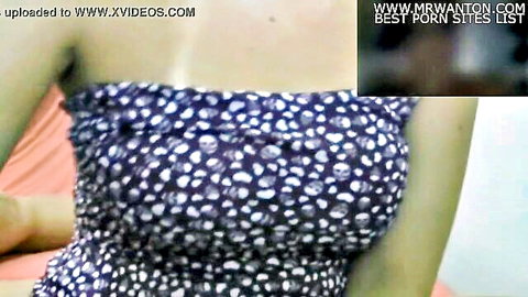 Busty Asian wife in skull-print strapless dress showing cleavage
