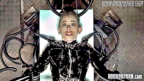 Pale blonde teen in shiny black latex catsuit surrounded by thick black tentacles in horror BDSM bondage