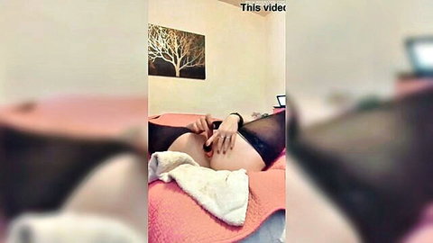Brunette BBW in black lingerie inserts tan anal toy into big ass on bed
