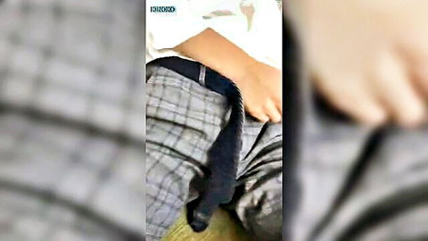 Bent over amateur with plaid pants down exposing pale ass and black anal dildo inserted