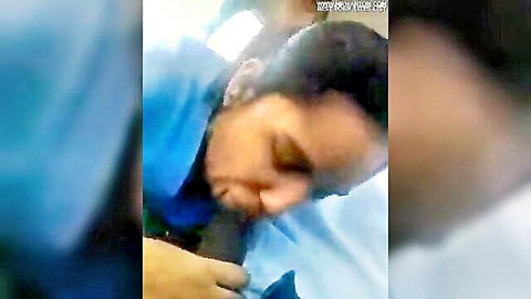 Blurry Indian nurse in scrubs leans over sleeping patient's crotch giving implied blowjob in hospital.