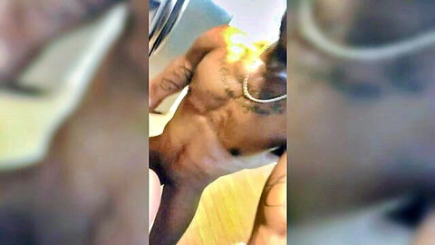 Muscular black stud poses nude flaunting his huge erect cock and ripped abs
