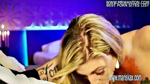 Busty blonde Nikky Clarisse seductively lying in bed for hot date