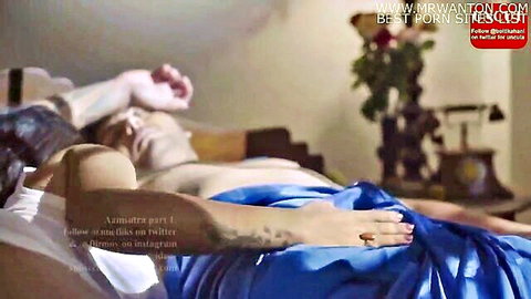 Sensual Indian massage scene with nude man lying on bed, woman touching him