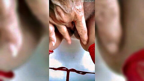 Wrinkled hands spreading open wet shaved pussy lips exposing pink vaginal hole