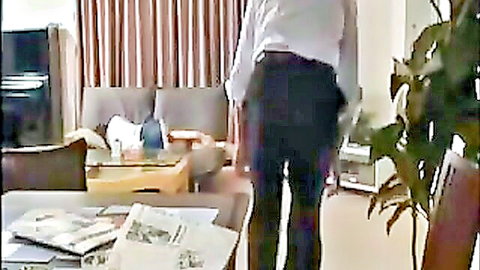 Japanese man in white shirt and black pants from behind in home setting, family JAV thumbnail