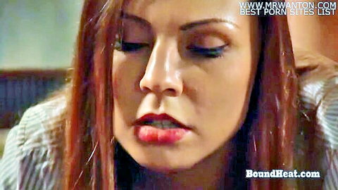 Close-up of sexy redhead with aroused expression, parted glossy lips and sultry eyes half-closed
