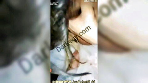 Blurry Arab woman with braids exposing skin in intimate scene