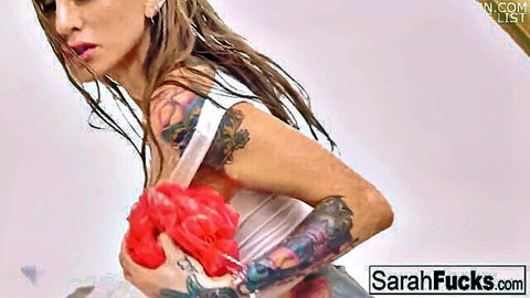 Tattooed beauty Sarah in wet white top, teasing with sponge in shower