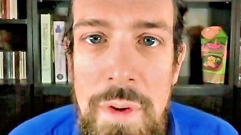 Bearded man in blue shirt discussing porn, casual home setup