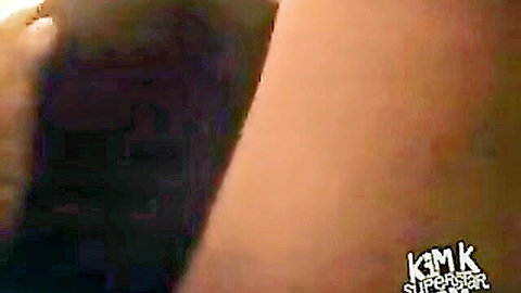KimK curvy side pose highlighting big ass in black thong