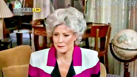 Mature blonde with big silver hair in pink dress, Golden Girls parody scene