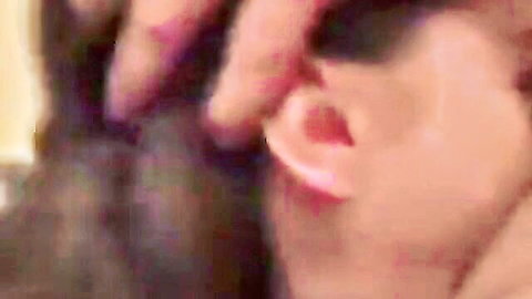 Close-up of pretty Latina woman with hand caressing her ear and dark hair