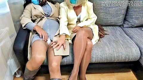 Pregnant brunette and blonde in stockings touching thighs intimately