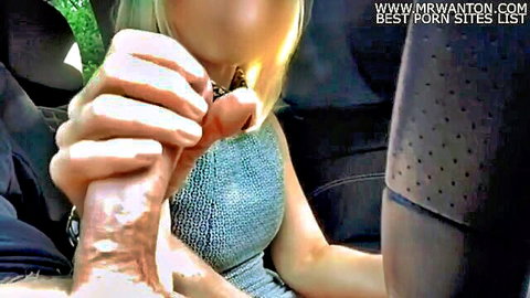 Blonde woman handjobs thick cock with cum dripping in car
