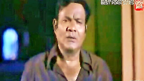 Intense South Asian Indian man in open maroon shirt stares hungrily in desi episode