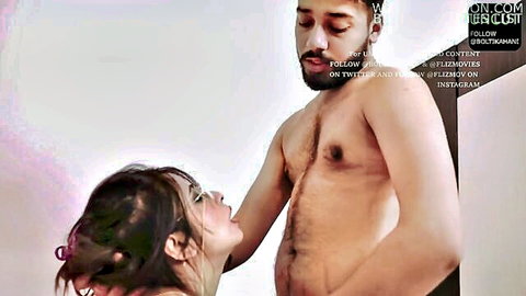Indian woman intimately kissing shirtless man's torso in web series