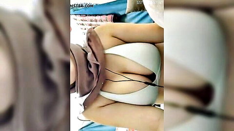Nurul Farzana Sakinah tudung teasing with deep cleavage in white bra