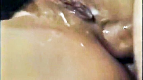 Vintage closeup of trimmed Caucasian pussy and ass dripping thick cum after creampie.