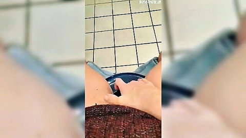 Amateur wife masturbates in work toilet with jeans pulled down