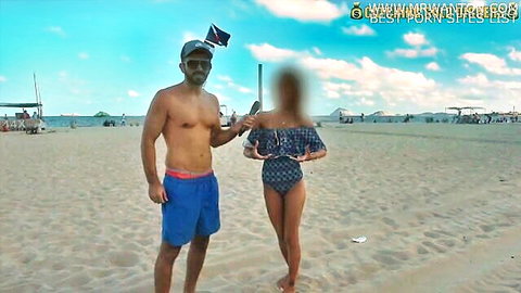 Shirtless tanned hunk stands with skinny bikini teen on sunny beach pick up