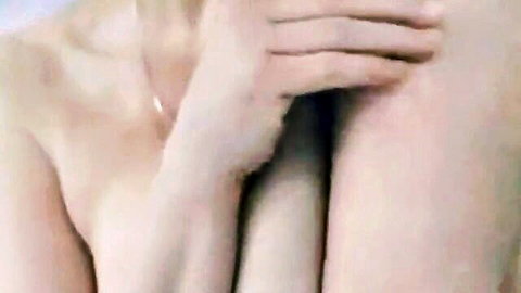Pale-skinned woman teasing nude in morning solo play