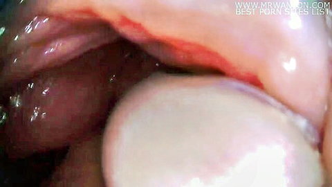 Extreme close-up of cum inside wet pussy from internal camera view