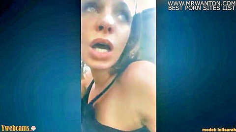 Shocked brunette woman with wide eyes and open mouth in roadtrip car sex scene
