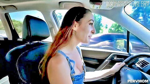 Brunette MILF in skimpy denim overalls drives car exposing deep cleavage and big tits