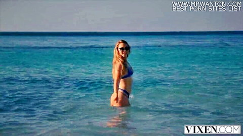 Stunning blonde in blue bikini on steamy lesbian vacation beach