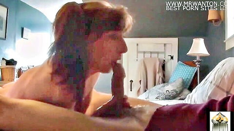 Mature granny with brown hair giving intense oral to dildo, solo blowjob
