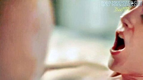 Close-up of lesbian tribbing orgasm with ecstatic open-mouth expression