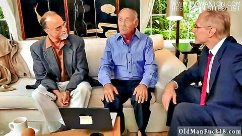 Three mature men in suits on couch viewing laptop in gangbang preview
