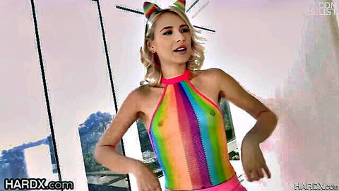 Blonde teen with cat ears poses in sheer rainbow halter top exposing small perky tits and nipples
