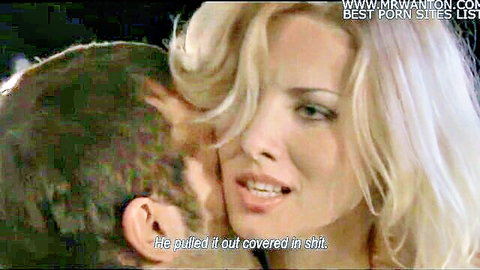Blonde woman passionately kissed by man in erotic Monamour scene
