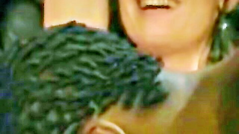 Ebony woman smiling wide with braided black man in intimate closeup