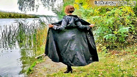 Brunette mature PAWG flashing her bare juicy ass outdoors by lake in open black coat