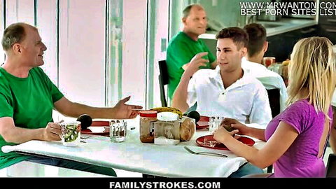 Blonde stepmom at family dinner with stepson and relatives