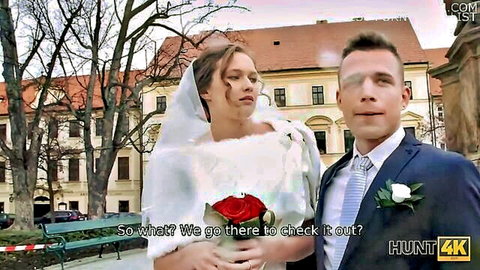 Brunette Czech bride in white wedding dress poses with suited groom outdoors before hot cuckold sex
