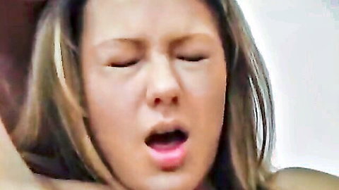 Blonde woman eyes closed mouth wide open moaning in sexual ecstasy closeup