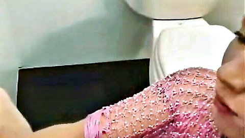 Asian beauty in pink sequin top at glory hole, lips ready for fun
