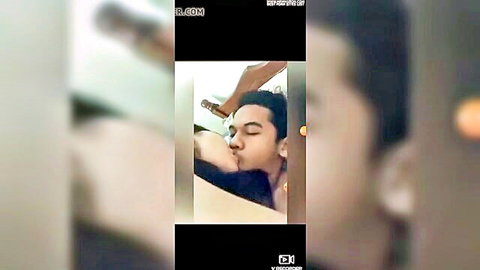 Malay couple intimate kiss with boyfriend holding girlfriend's head close-up