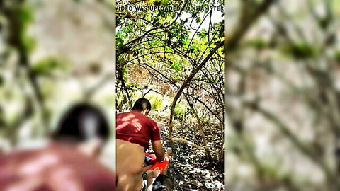 Athletic man exposing bare ass in outdoor woods for casual sex