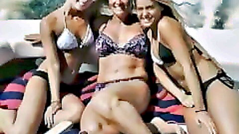 Sexy MILF and daughters in bikinis lounging poolside, family tease