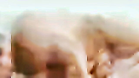Blonde nude woman in explicit oral sex scene, intense adult video thumbnail