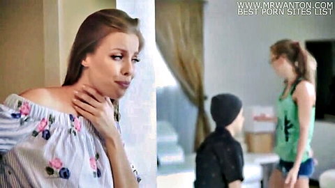 Stepmom in off-shoulder floral blouse touching neck seductively, casual home scene with son